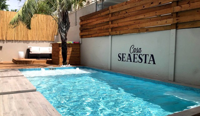 Steps away from the beach, this fully stocked house is perfect for your group! in Santurce